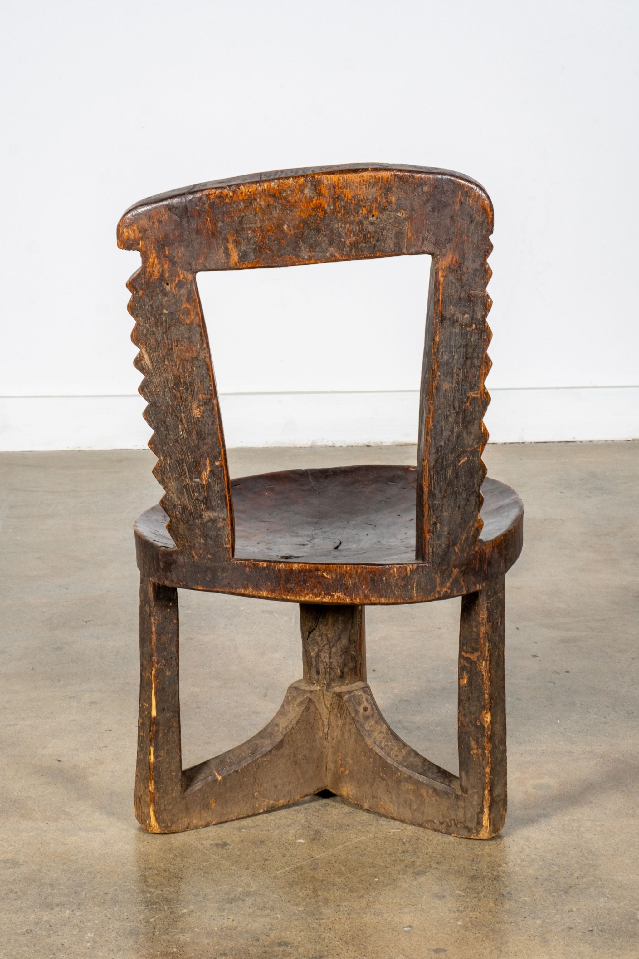 3-legged African Wood Chair with Scalloped Back
