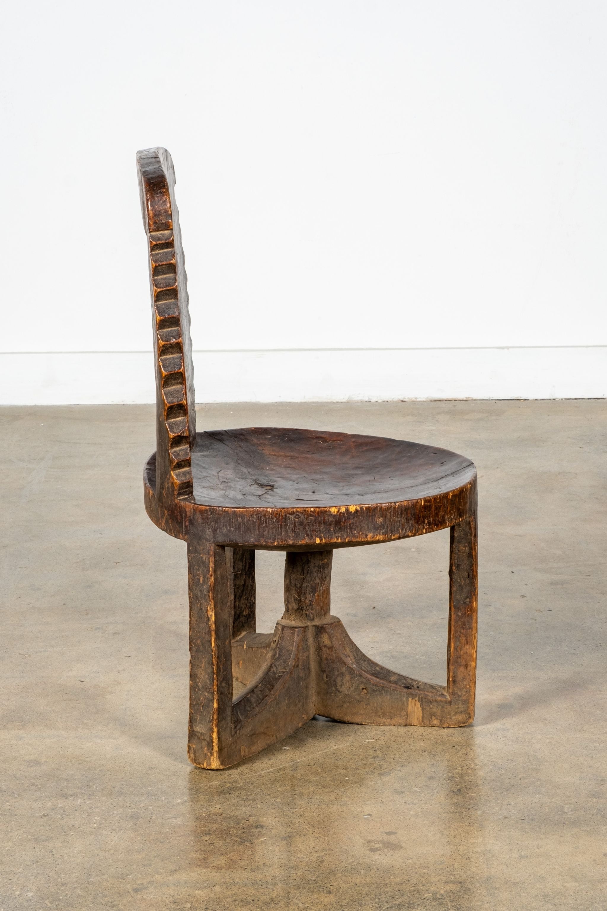 3-legged African Wood Chair with Scalloped Back
