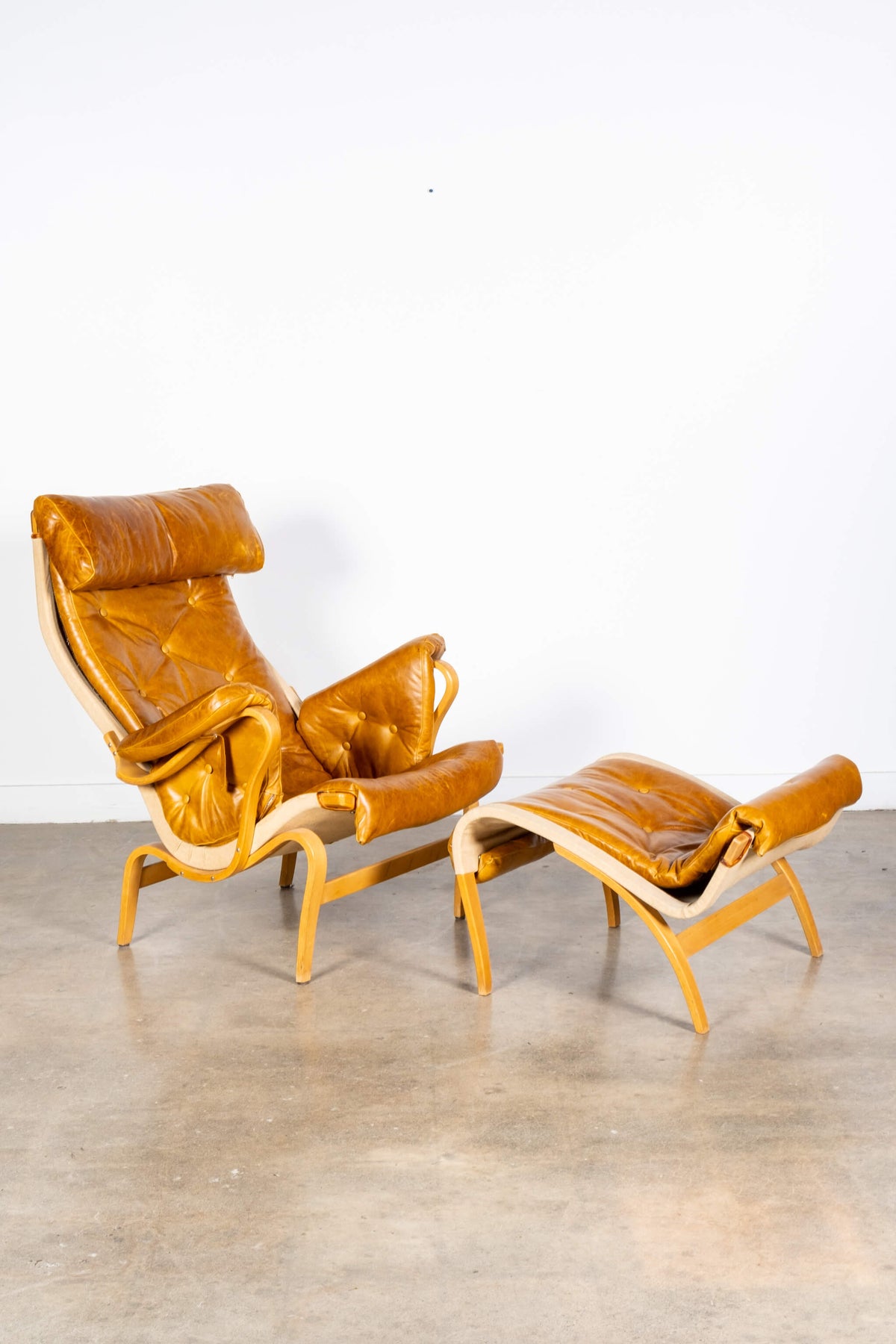 Pernilla 69' Leather and Beech Chair and Ottoman
